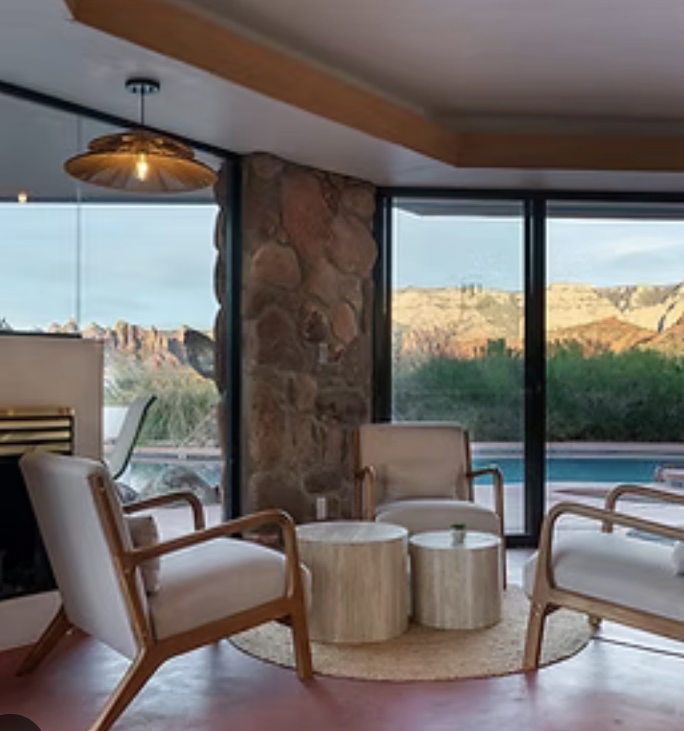 Stone fireplace lounge with Sedona red rock views